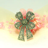 Elegant Silver Bow Brooch - Silvenca